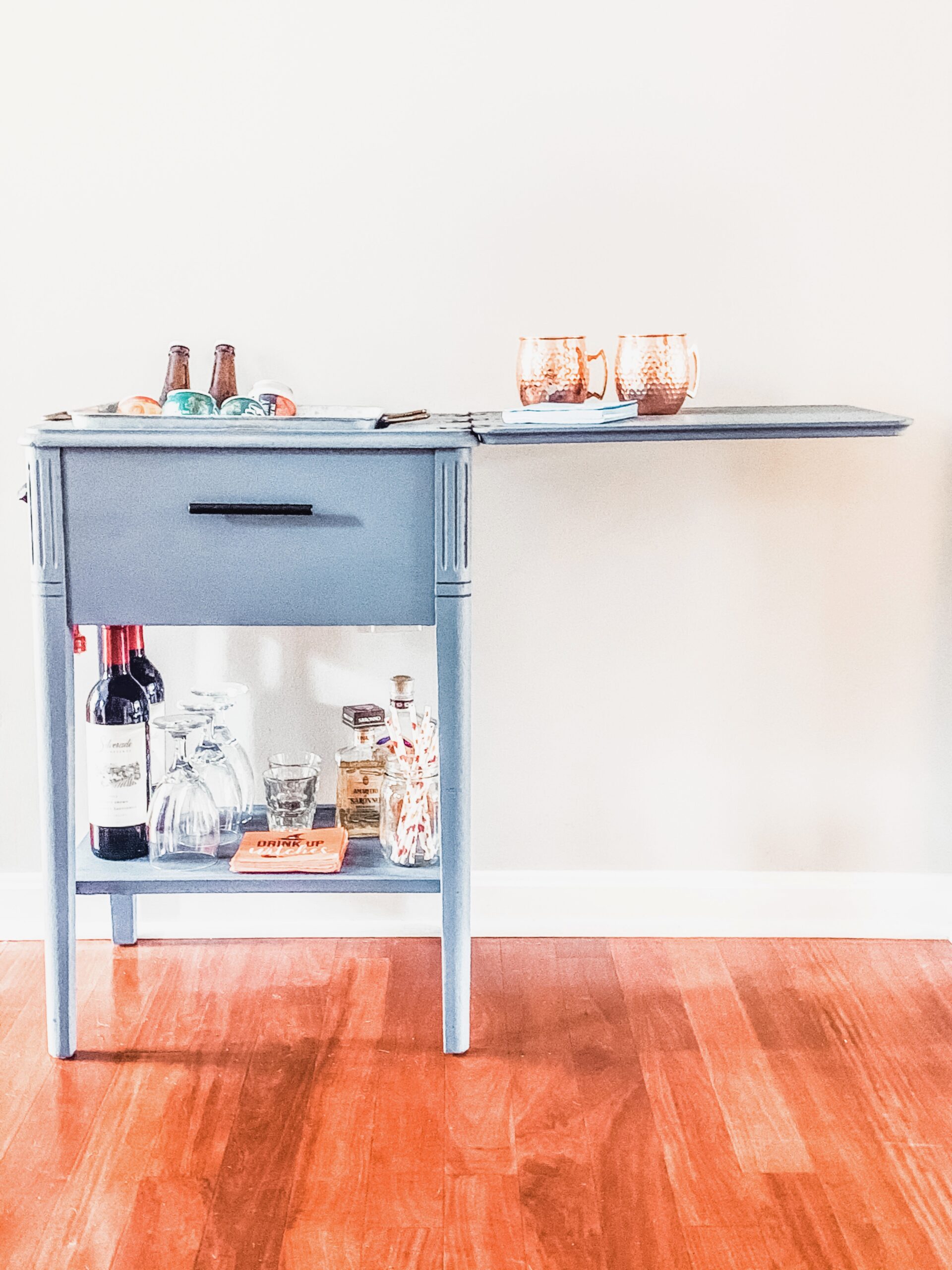 sewing machine turned into bar cart