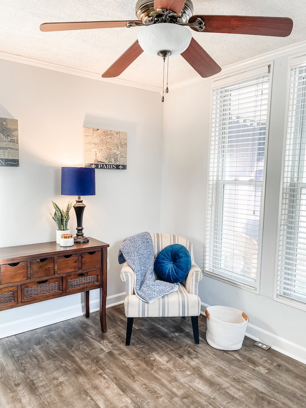 blue and white chair in corner of living room