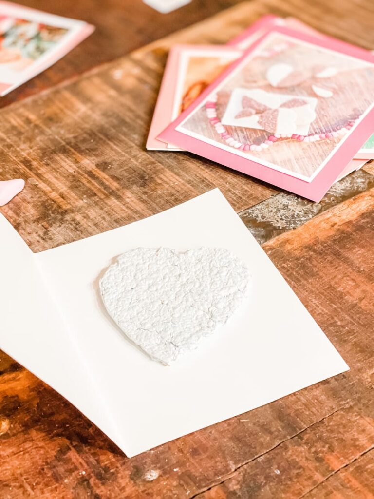 paper seed heart laying inside a valentine card