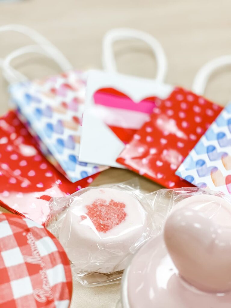 TINY GIFT BAGS WITH SHOWER MELTS NEXT TO THEM