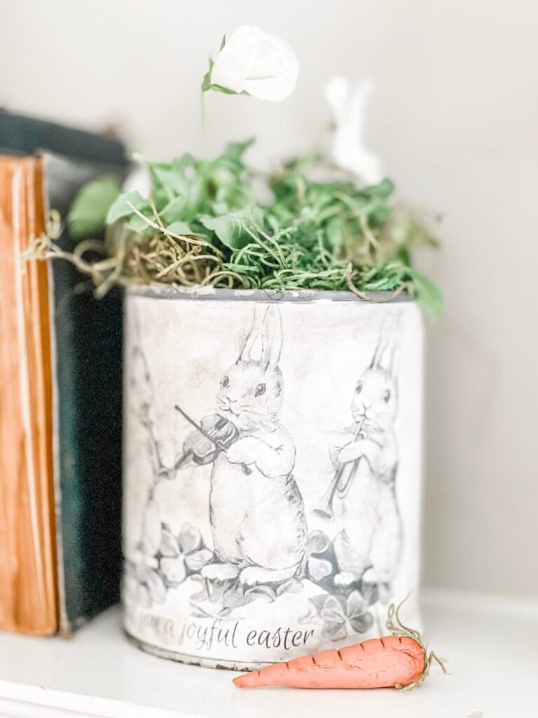 quart paint can upcycled into a bunny planter with pansies inside