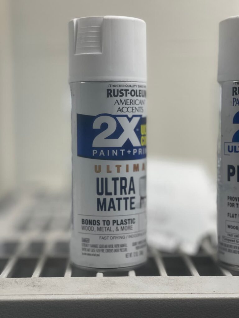 CAN OF WHITE PRIMER SPRAY PAINT