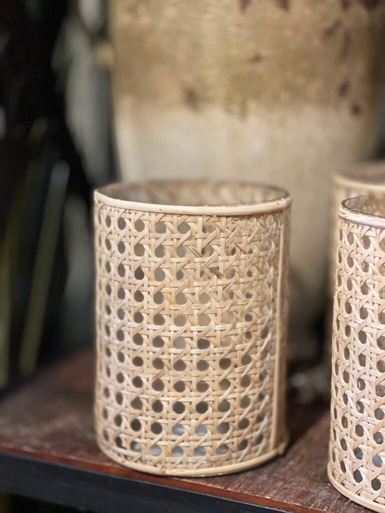 two round vases with caning around them