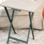 AN UPDATED WOODEN TV TRAY TABLE IN FRONT OF A SOFA PAINTED GREY