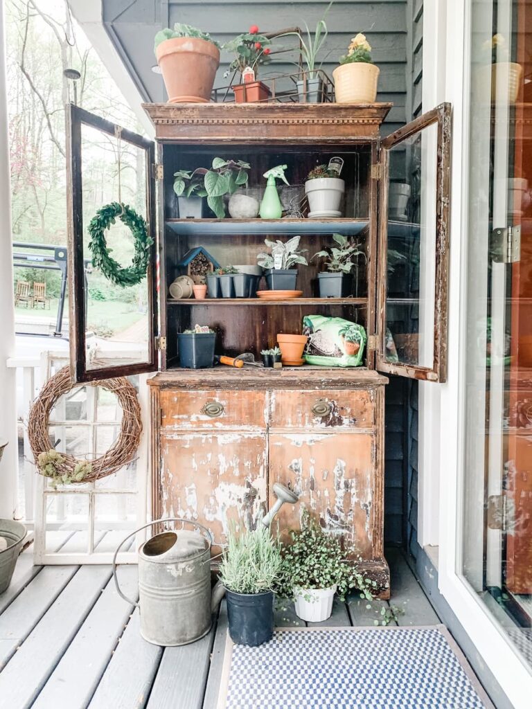 VINTAGE HUTCH ON MY PORCH DECORATED WITH POTTING SUPPLIES