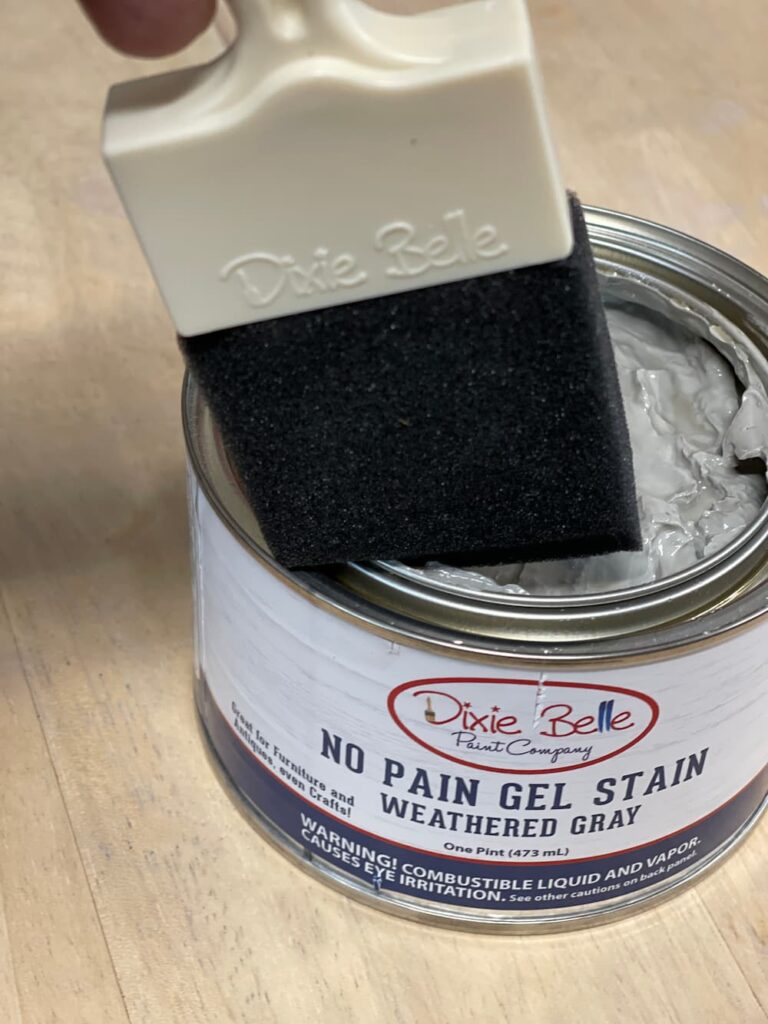 A CAN OF DIXIE BELLE NO PAIN GEL STAIN AND A FOAM BRUSH