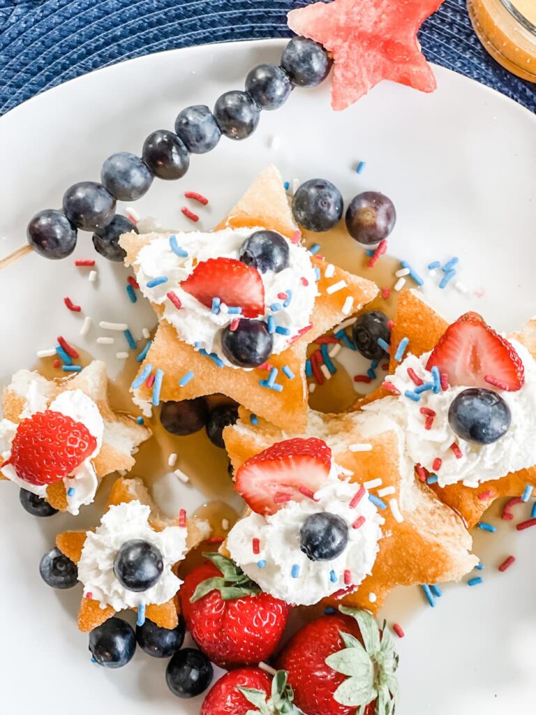 pancakes cut in shape of stars with whipped cream