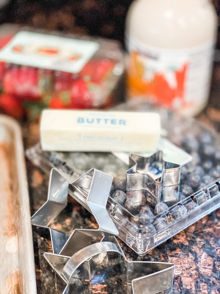 BUTTER, COOKIE CUTTERS, STRAWBERRIES, SHEET PAN