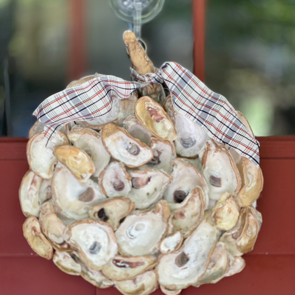 PUMPKIN OF OYSTERSHELLS HANGING ON THE DOOR