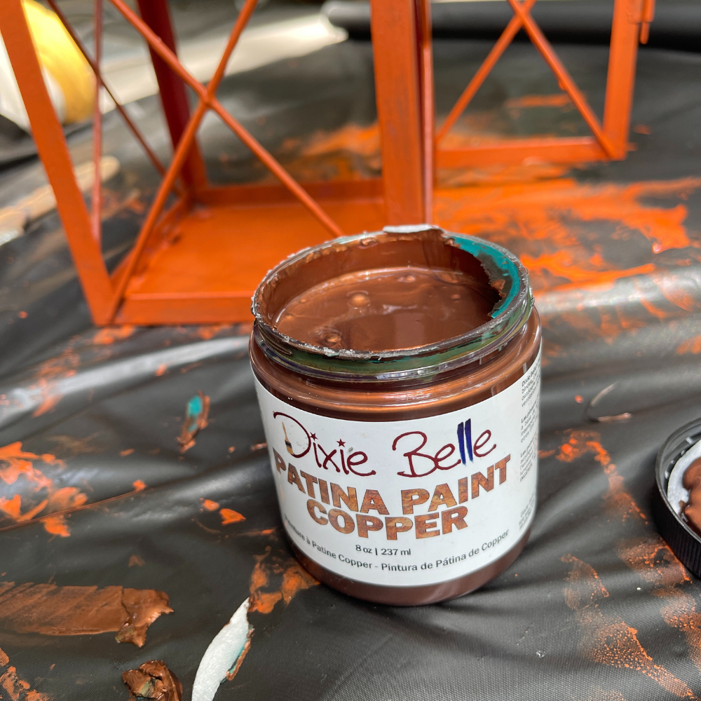 painting the lantern with my first coat of patina paint in copper