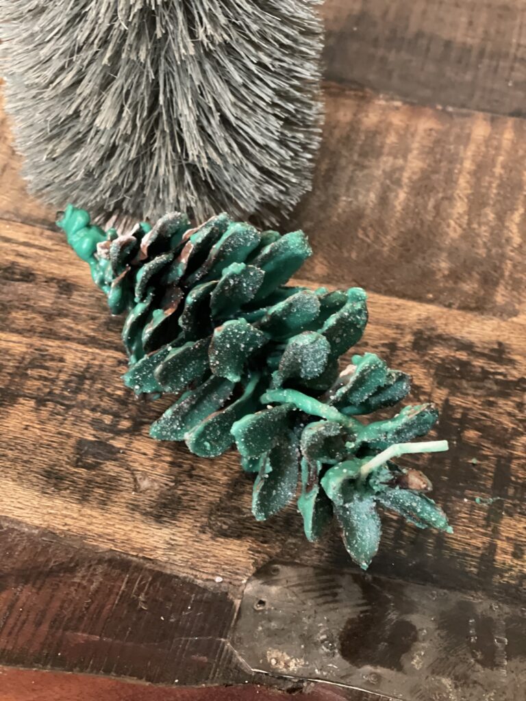 green wax covered pinecone